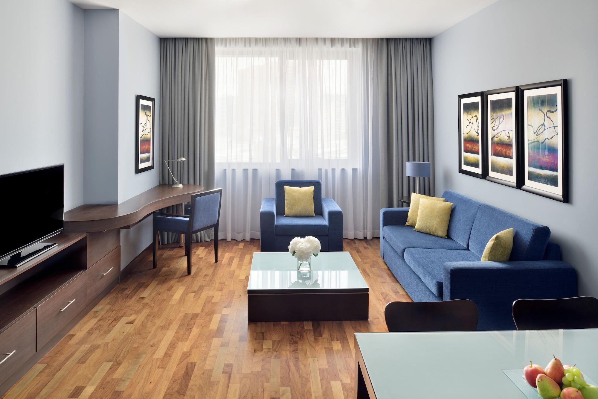 Moevenpick Hotel Apartments Al Mamzar Дубай Екстериор снимка A typical living room