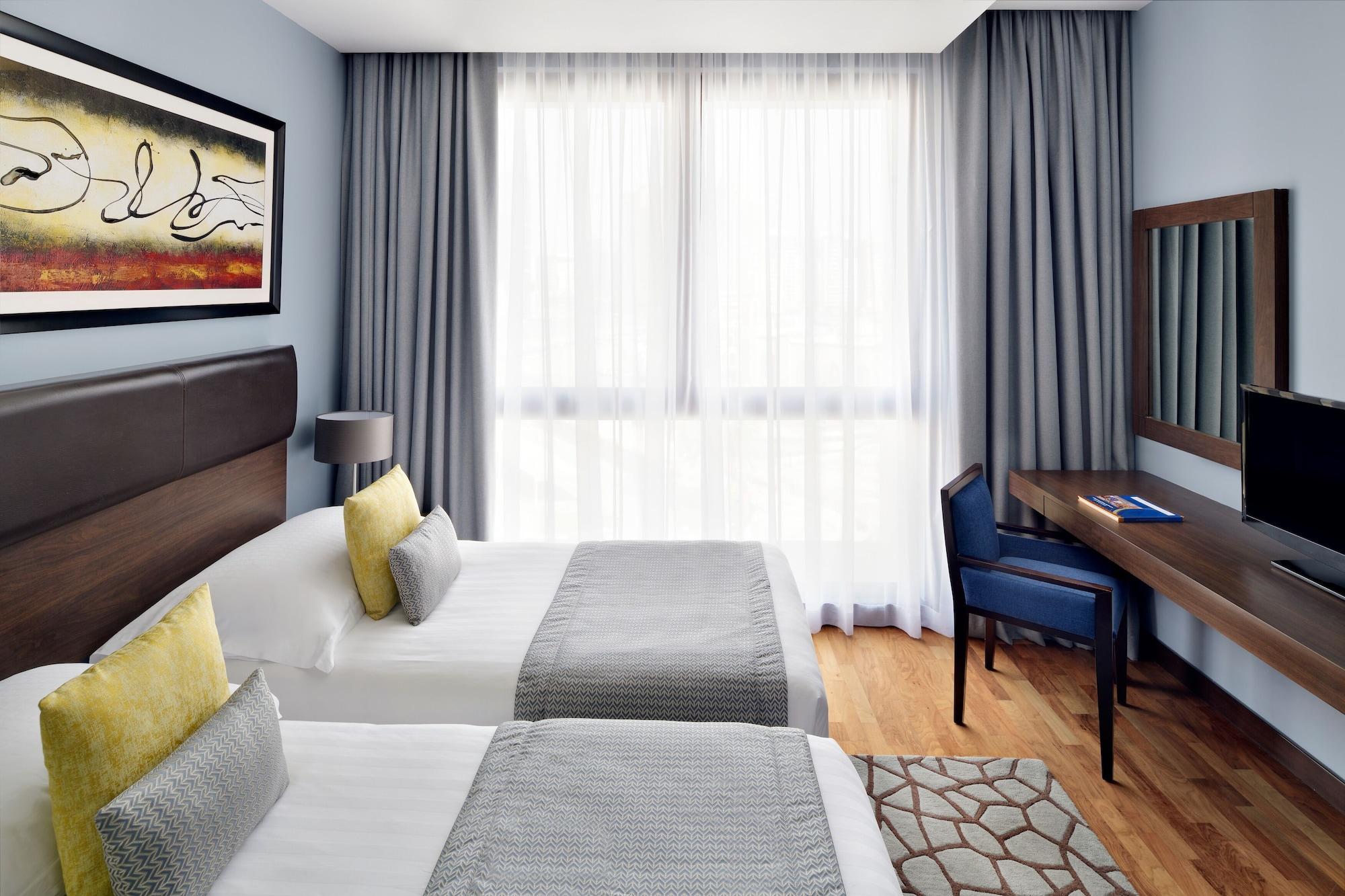 Moevenpick Hotel Apartments Al Mamzar Дубай Екстериор снимка A room at the hotel
