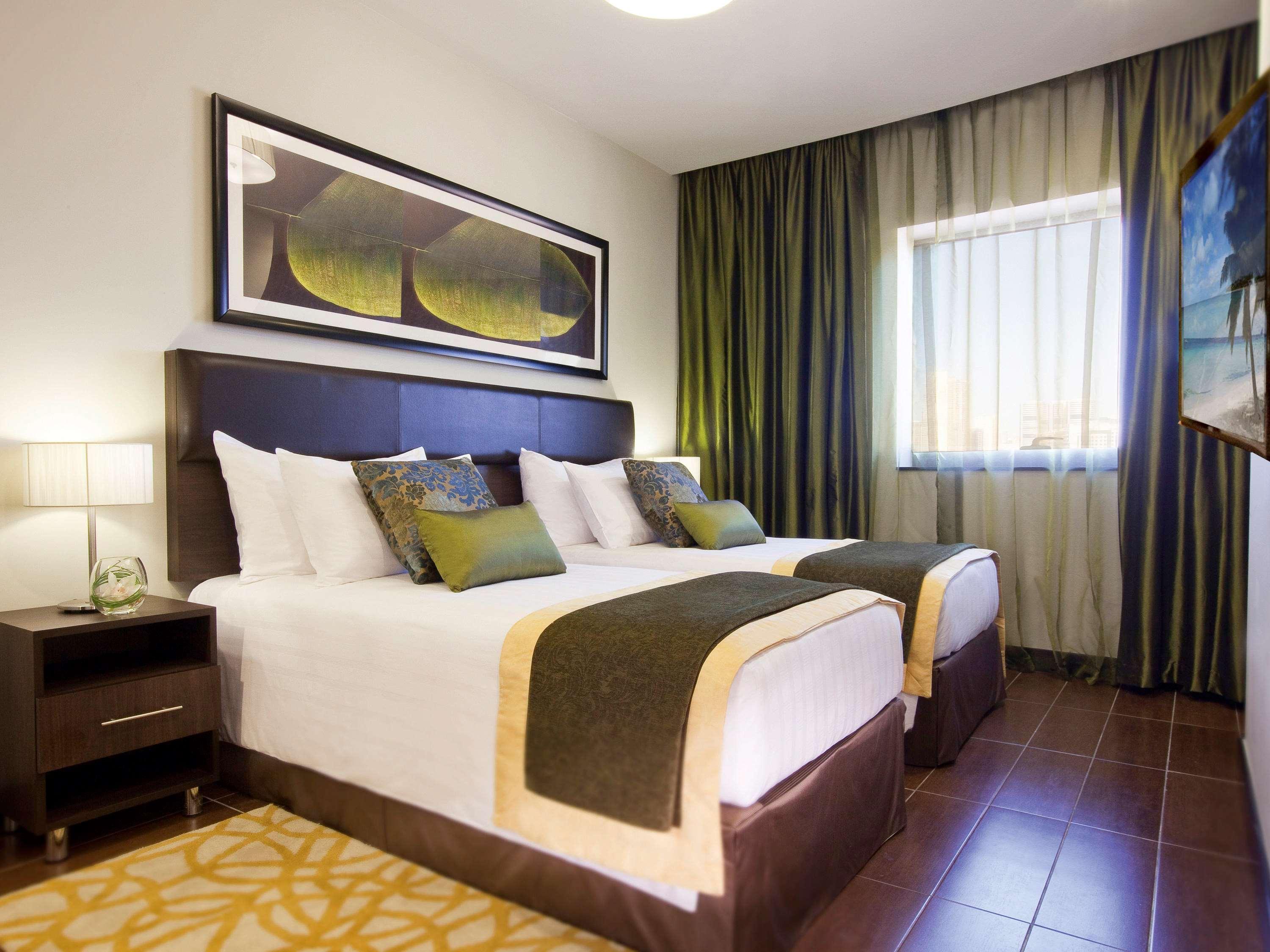 Moevenpick Hotel Apartments Al Mamzar Дубай Екстериор снимка A bedroom at the hotel