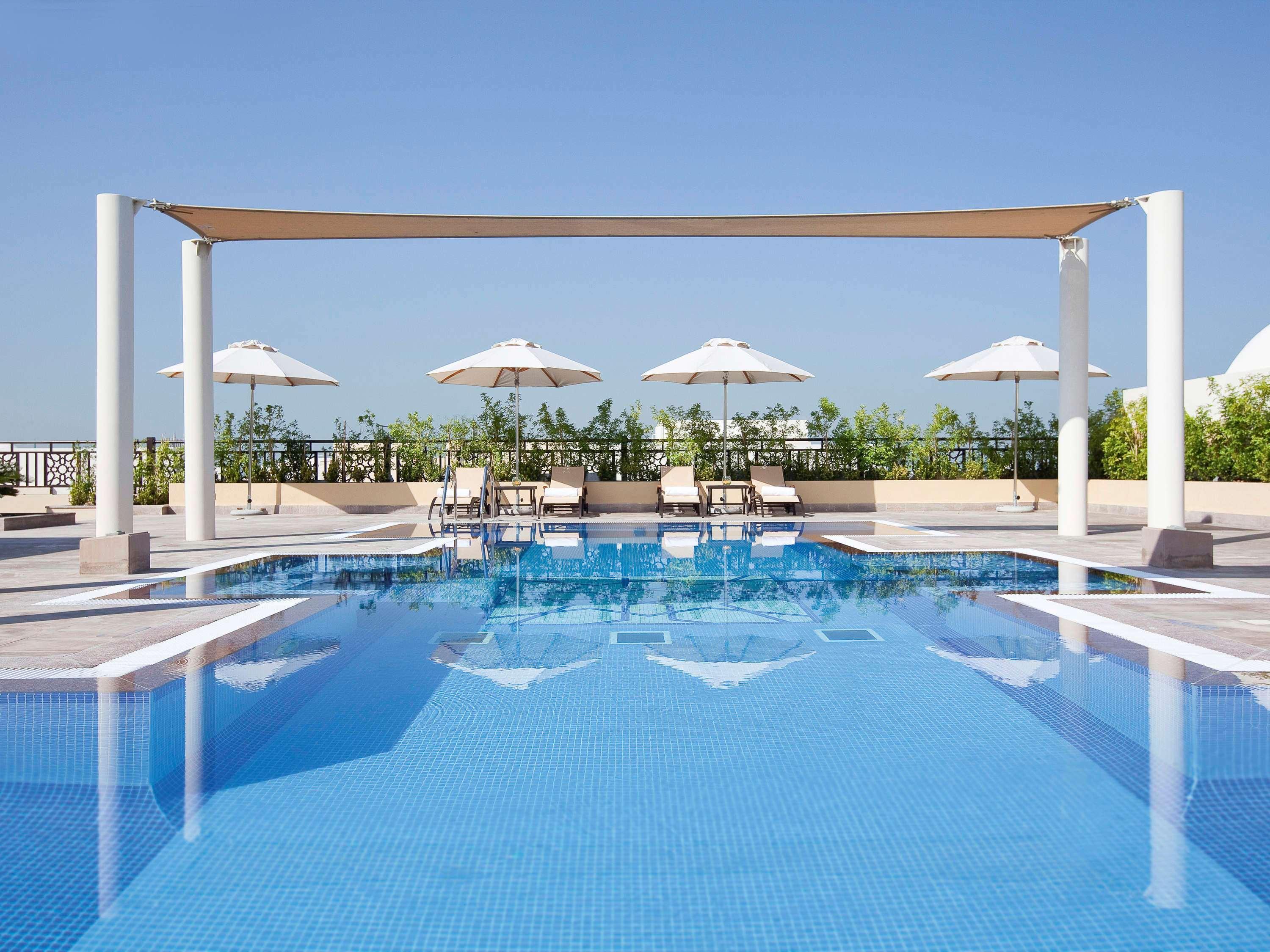 Moevenpick Hotel Apartments Al Mamzar Дубай Екстериор снимка Rooftop pool at the hotel