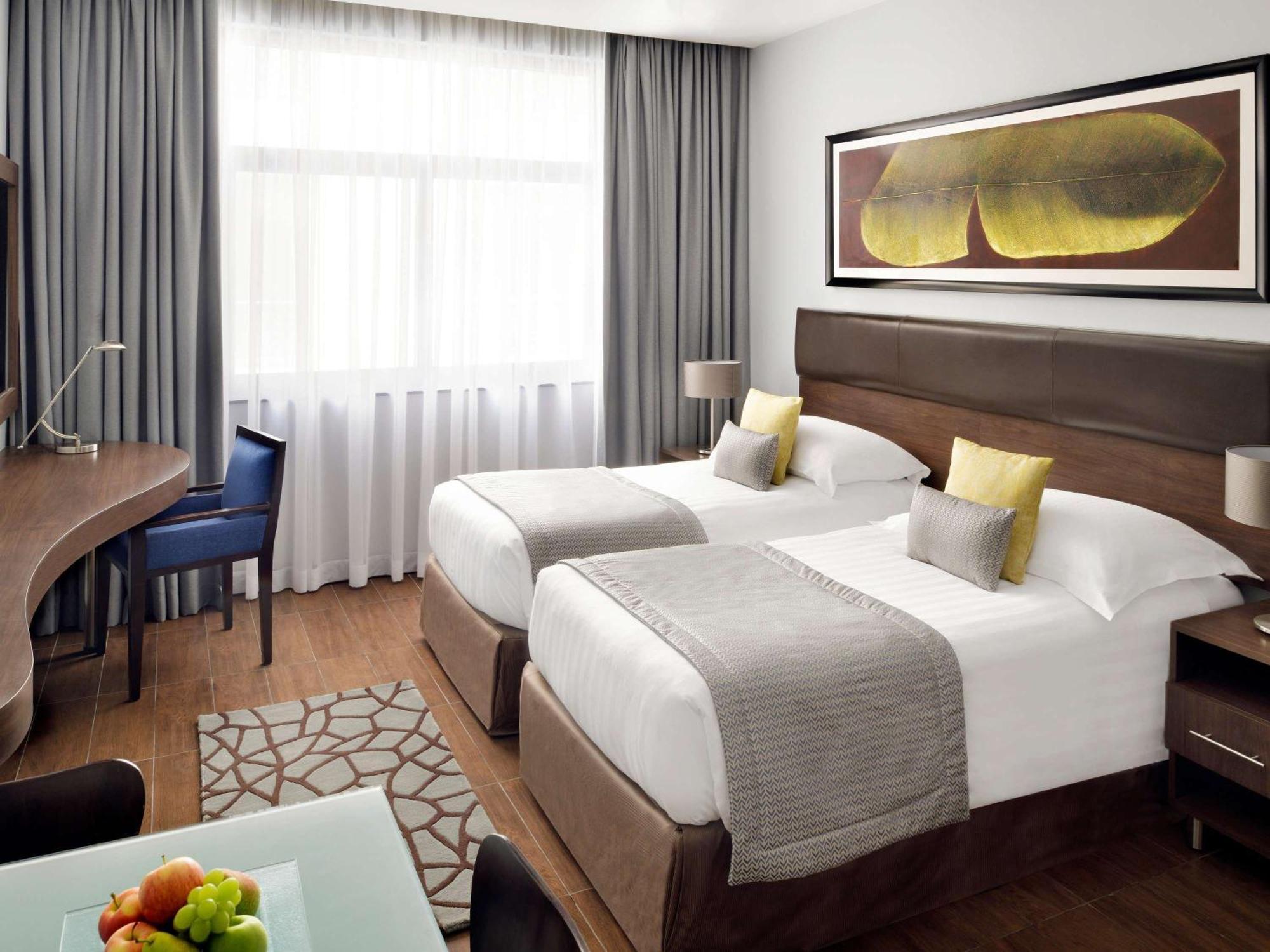 Moevenpick Hotel Apartments Al Mamzar Дубай Екстериор снимка A room at the hotel