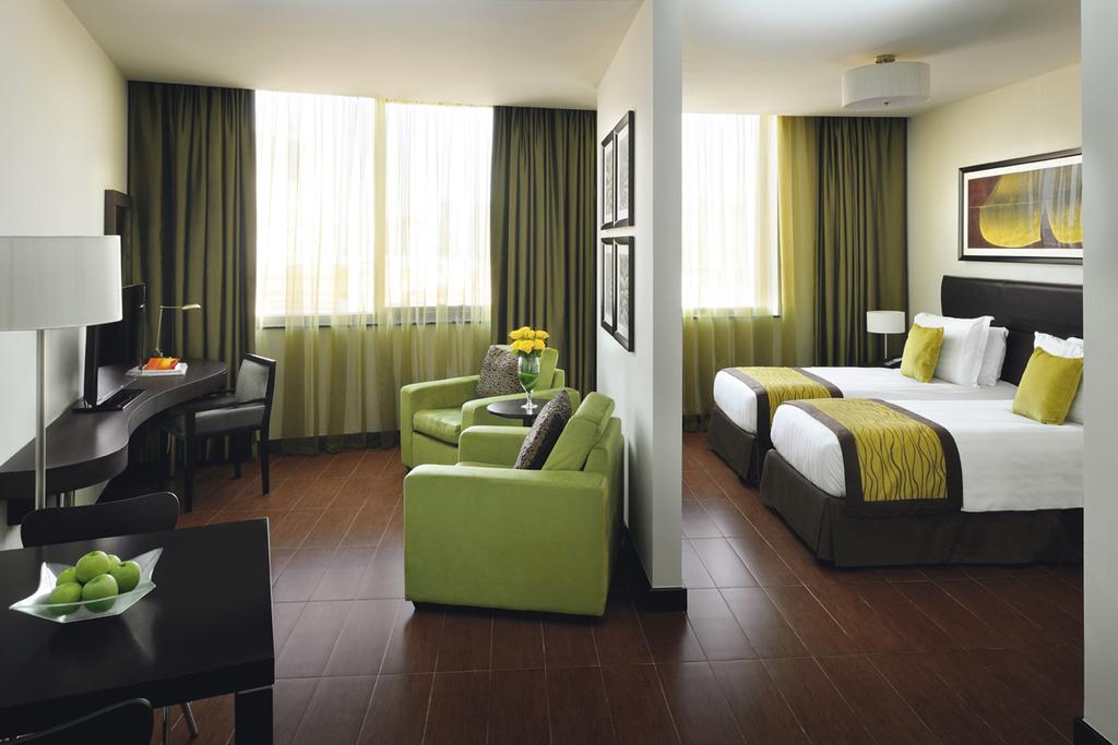 Moevenpick Hotel Apartments Al Mamzar Дубай Екстериор снимка A typical room at the hotel